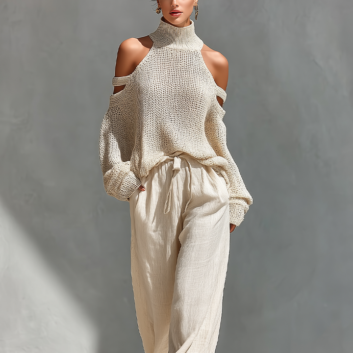 Set aus einem gestrickten Damen-Rollkragenpullover mit Cold-Shoulder-Ausschnitt und einer Hose mit weitem Bein