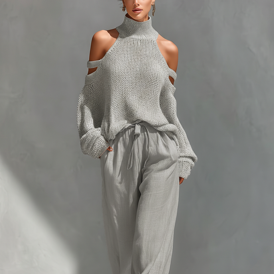 Set aus einem gestrickten Damen-Rollkragenpullover mit Cold-Shoulder-Ausschnitt und einer Hose mit weitem Bein