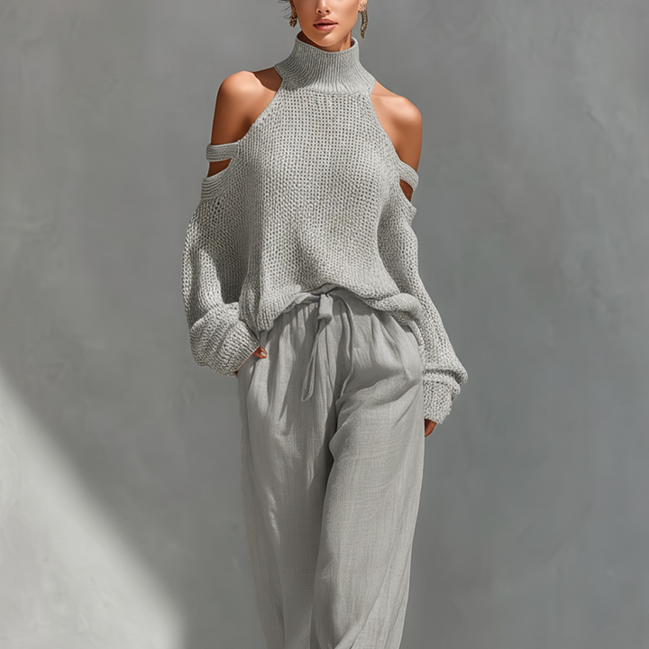 Set aus einem gestrickten Damen-Rollkragenpullover mit Cold-Shoulder-Ausschnitt und einer Hose mit weitem Bein