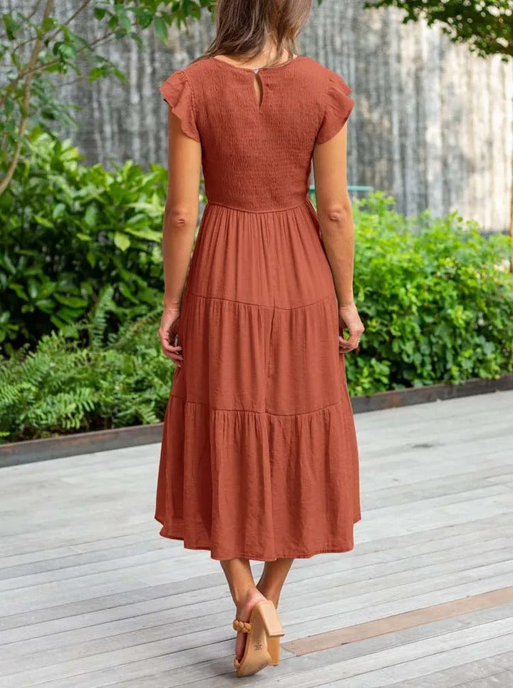 Raffiniertes bauchbedeckendes Kleid