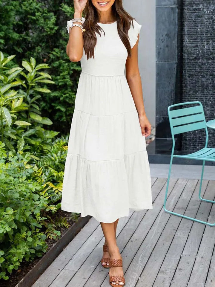 Raffiniertes bauchbedeckendes Kleid