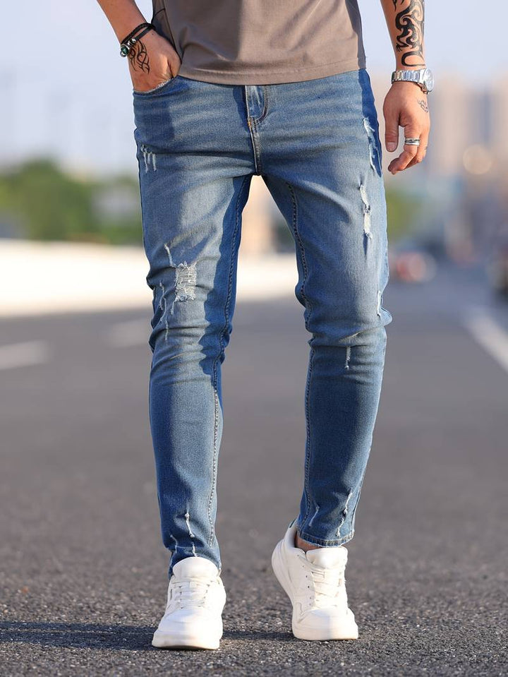 Herrenjeans Skinny-Jeans Fit mit Destroyed-Optik